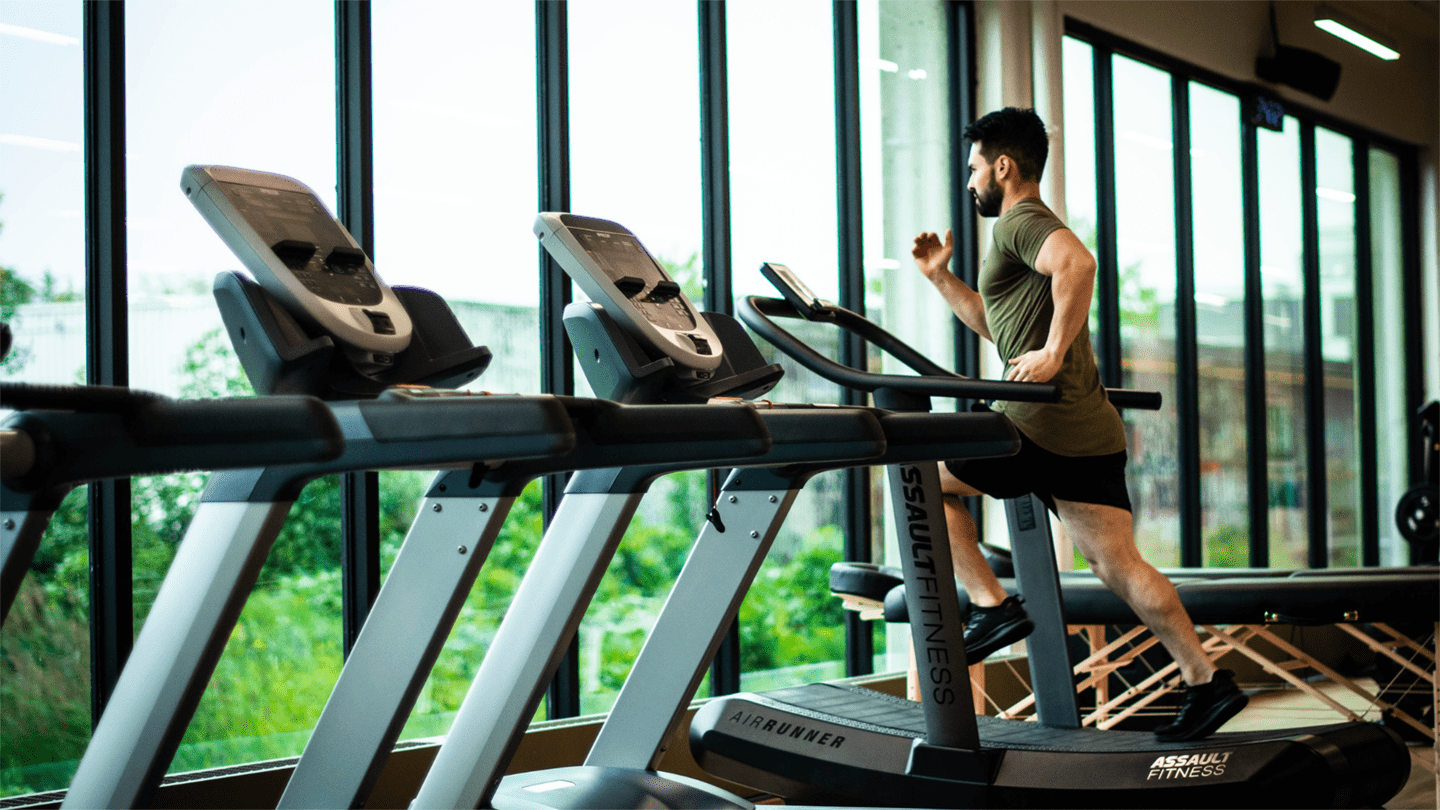 A person training on a running machine